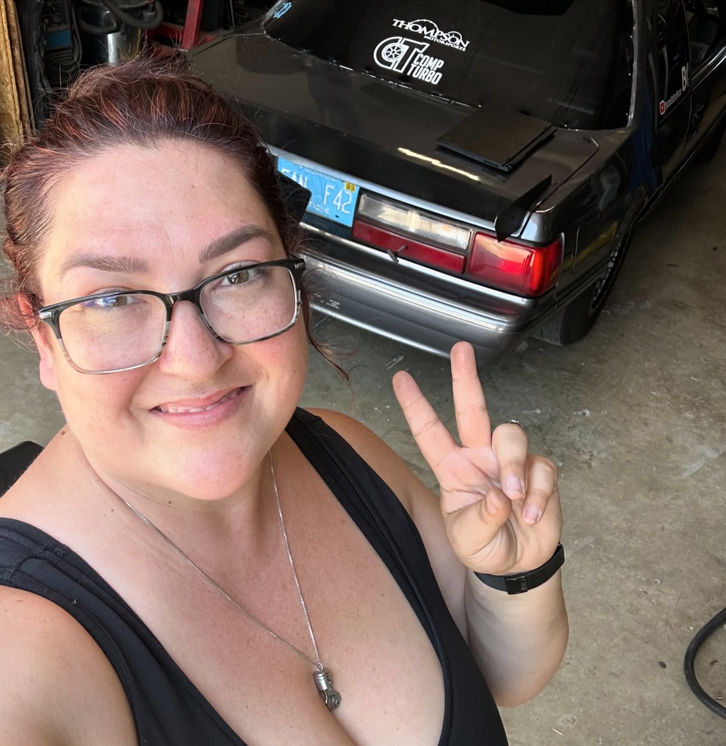 Amanda with the Foxbody in the garage