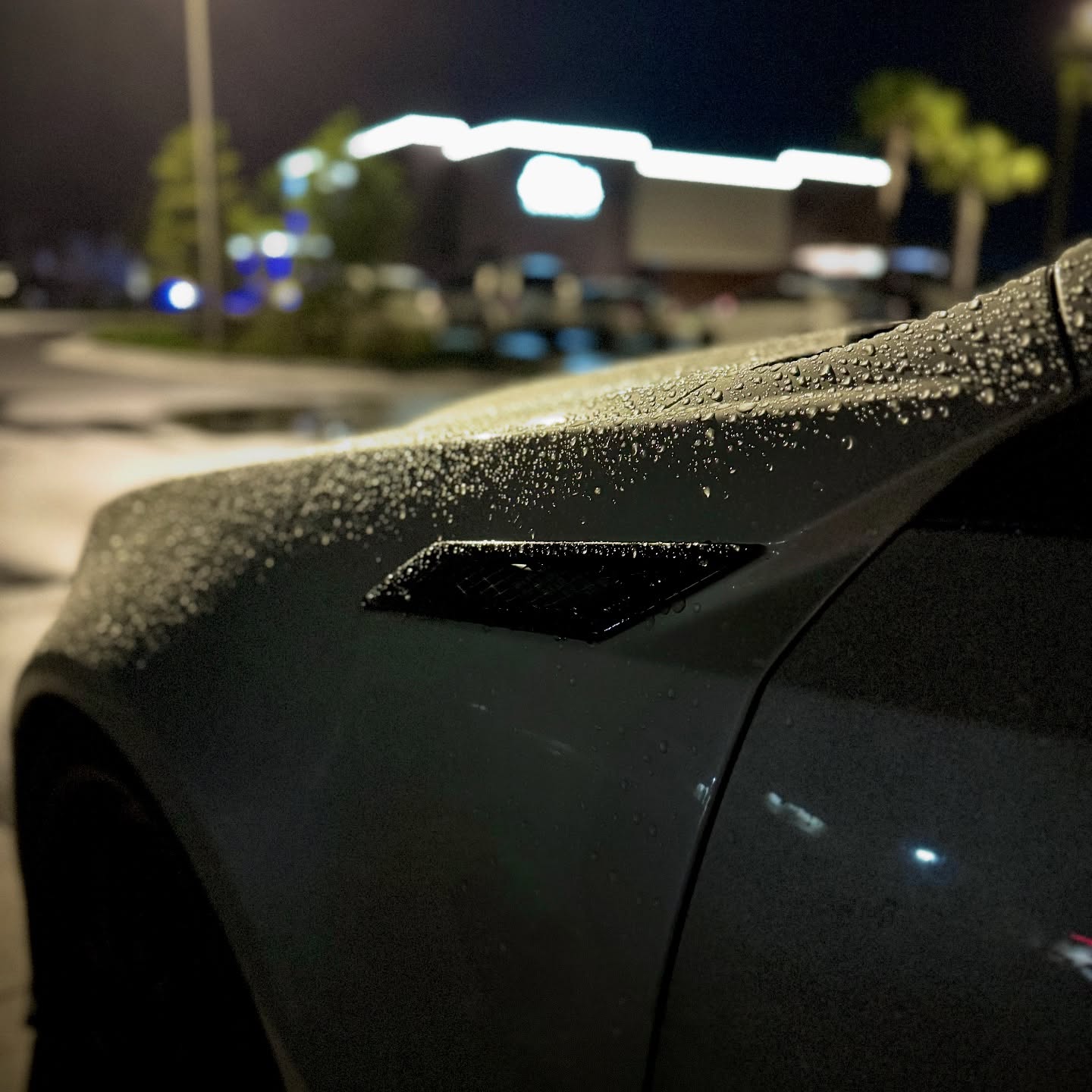 Cadillac detail with water beads